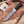 Stainless Damascus hunting knife with dark wenge handle displayed on wooden cutting board