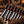 Stag Steel 7-piece Japanese kitchen knife set with red and dark wood handles