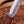 Close-up of VG10 Damascus bowie blade with fuller and forged Damascus guard
