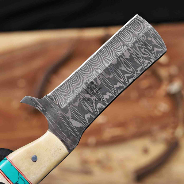 Close-up of a Damascus steel knife with a wooden handle on a blurred background