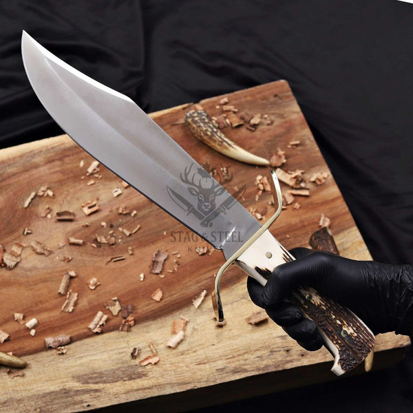 D2 western bowie knife with stag handle held in hand