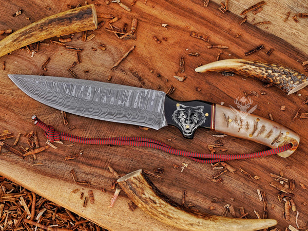 Hunter knife with wolf engraved handle handmade damascus steel blade