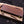 Closed wooden display box with brass latches for Feather Damascus bowie knife