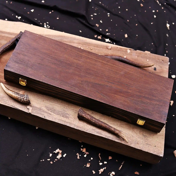 Closed wooden display box with brass latches for Feather Damascus bowie knife